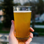 Beer Glass in Hand Mockup