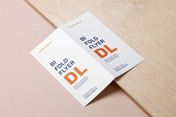 Bifold Dl Flyer Lying on a Wooden Board Mockup
