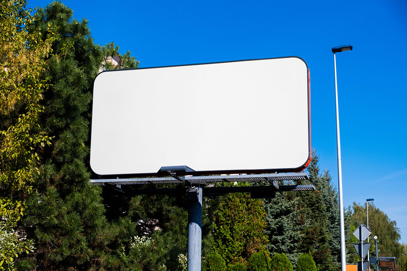 Free Billboard in City Mockup PSD Template