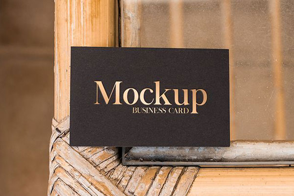 Business Card on a Wooden Table Mockup