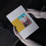 Book in Hand Mockup From Birds Eye View