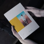 Book in Hand Mockup From Birds Eye View