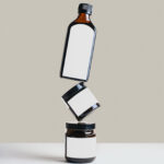 Bottle and 2 Jars Floating on Each Other Mockup