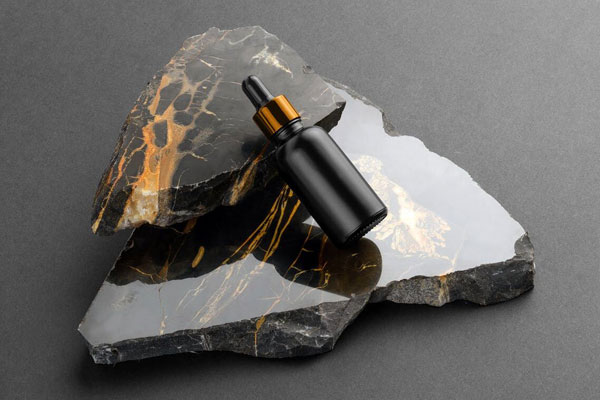 Bottle with Dripper Cosmetics Mockup on a Marble Stones