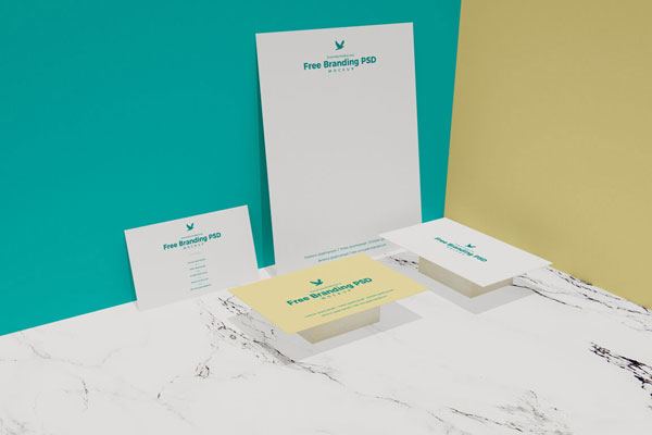 Branding Mockup of 3 Business Cards and a Paper Sheet