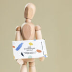 Business Card Held in Hands of a Wooden Manikin Mockup