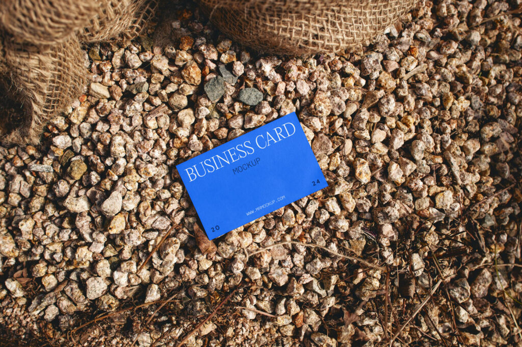 Business Card Laying on Stones Mockup