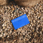 Business Card Laying on Stones Mockup