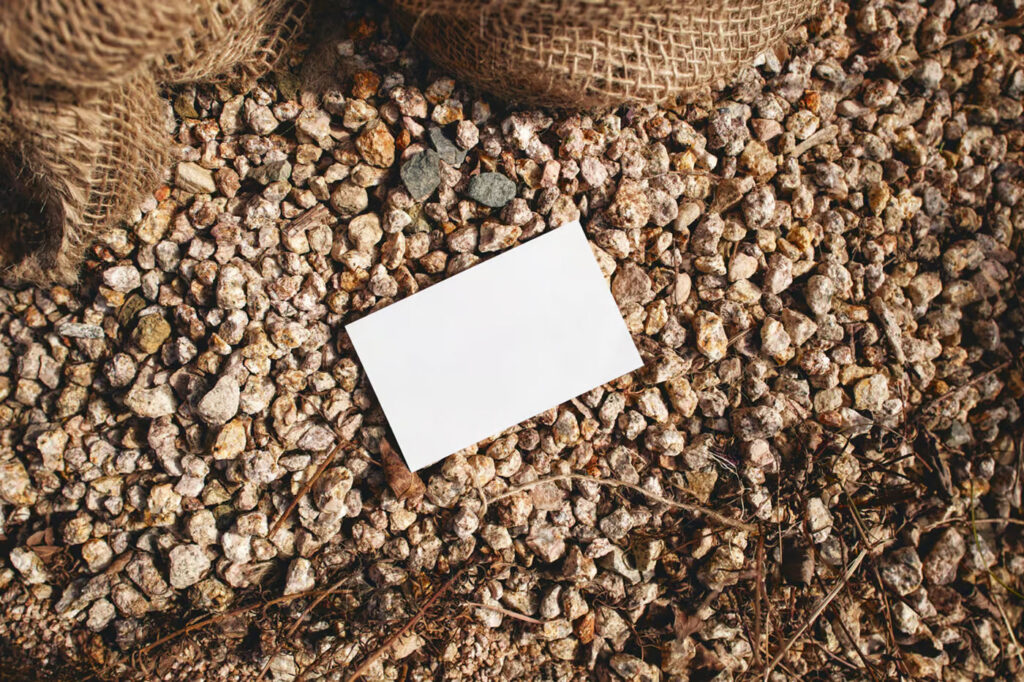 Business Card Laying on Stones Mockup
