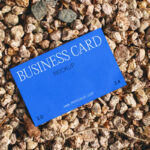Business Card Laying on Stones Mockup
