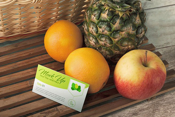 Business Card Mockup with Oranges, Apple, and Pineapple
