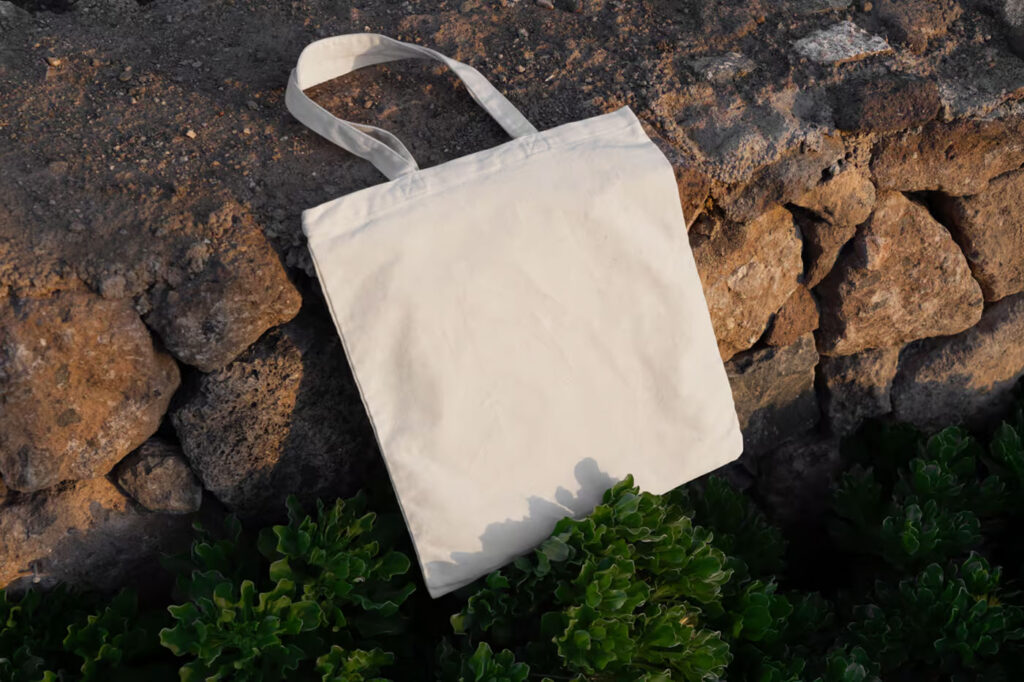 Canvas Bag Laying on Stones Mockup