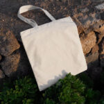 Canvas Bag Laying on Stones Mockup