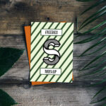 Card Mockup with Plant and Wooden Background