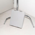 Cardboard Box Leaning Against Tripod Mockup