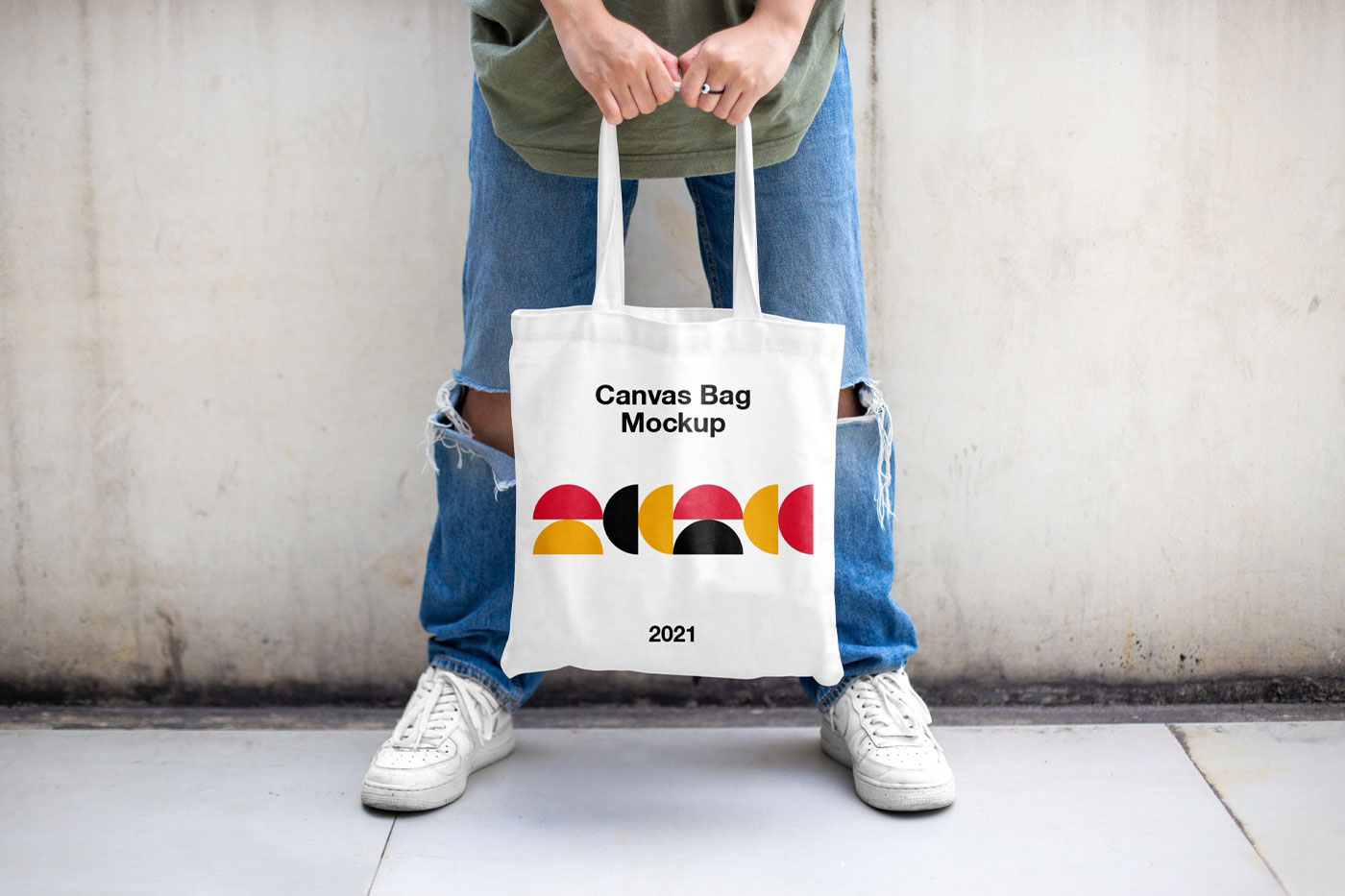 Casual Outdoor Man Holding Canvas Bag Mockup from Front View FREE PSD