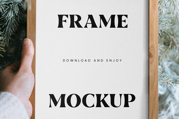 Close-up Vision of Wooden Frame Mockup in Hand