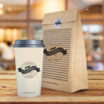 Coffee Cup and Paper Bag on Wooden Texture Mockup
