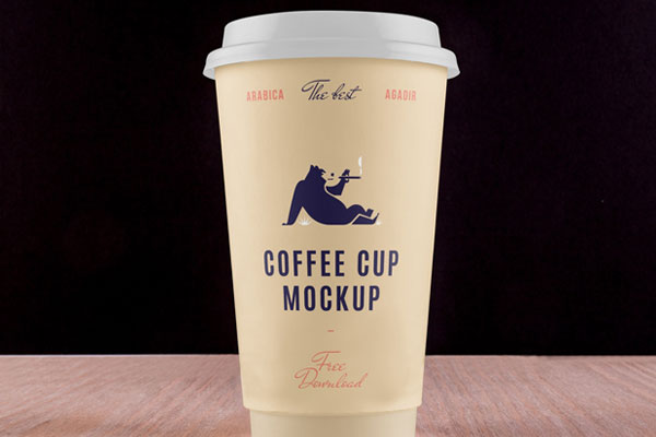 Coffee Cup Placed on Table in Front View Mockup