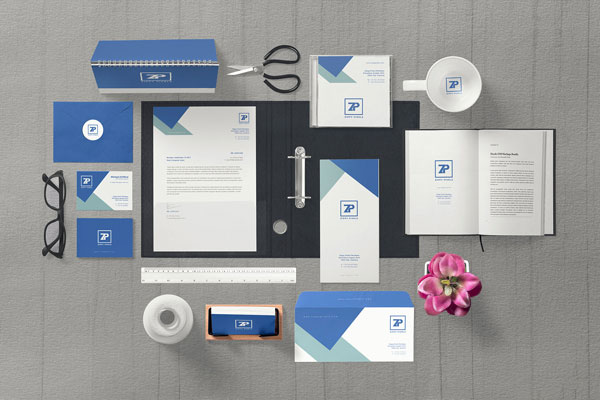Corporate Identity Mockup Scene Including Open Book, Letterhead, Envelopes, etc.