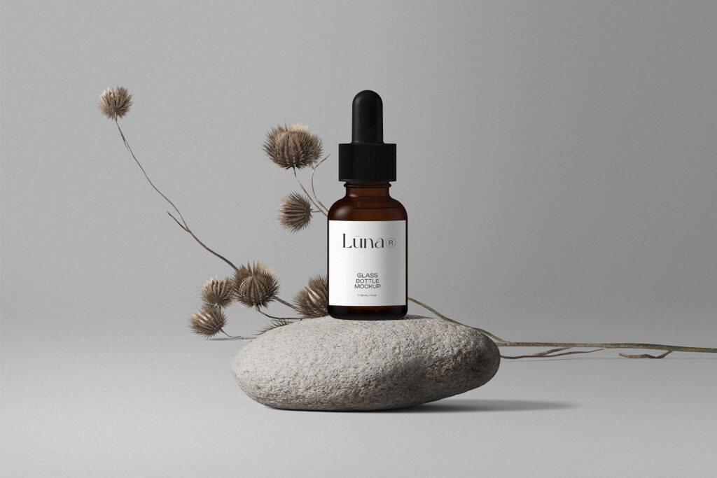 Cosmetic Bottle Mockup with Flower on Stone in Front View