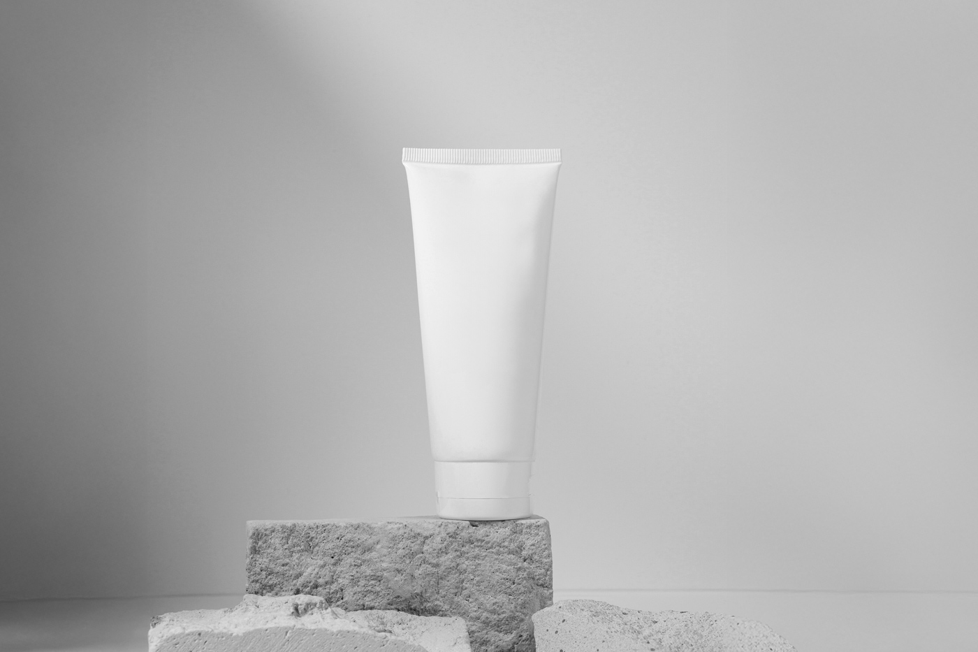 Free Cosmetic Tube on Rocks Mockup PSD Template