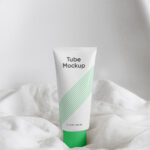 Cosmetics Tube Standing on a Sheets Mockup