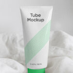 Cosmetics Tube Standing on a Sheets Mockup