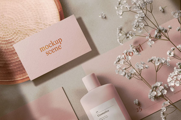 Different Sizes Cards and Cosmetic Bottle in Floral Setting Mockup