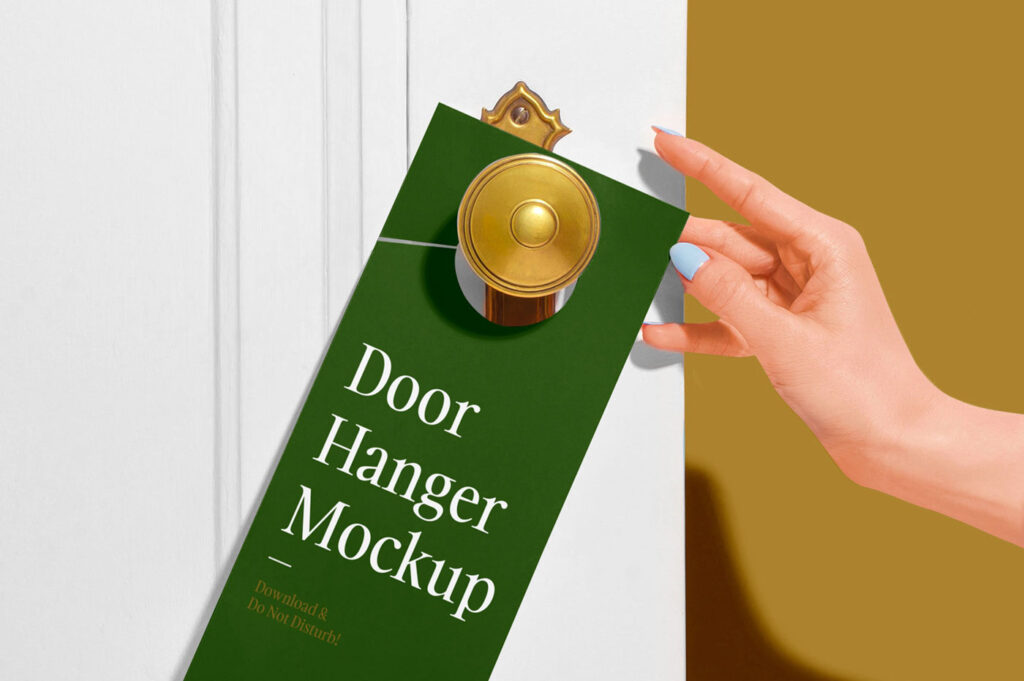 Door Hanger on a Wooden Door Besides a Woman’s Hand Mockup