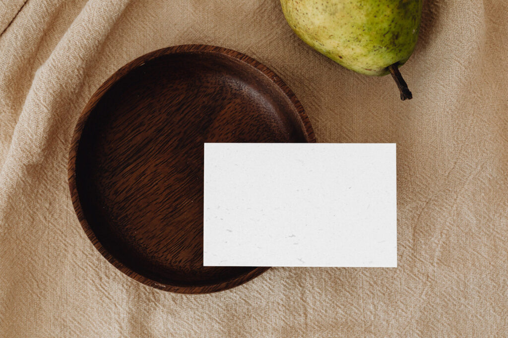Eco Paper Card Mockup with Wooden Plate in Top Sight