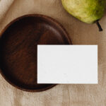 Eco Paper Card Mockup with Wooden Plate in Top Sight