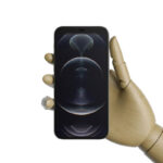 ٍiPhone 12 in a Wooden Hand Mockup