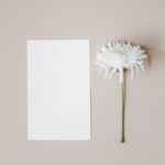 Elegant Vertical Paper Card Mockup with Daisy