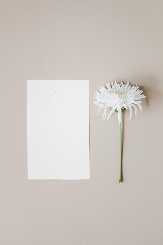 Elegant Vertical Paper Card Mockup with Daisy