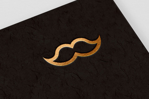 Embossed, Gold Foil Logo on Textured Background in Perspective Mockup