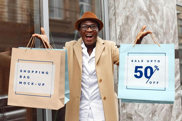 Excited Man Holding Shopping Bags Mockup