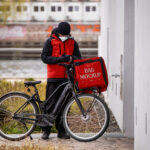 Facing Shot of Food Delivery Man Mockup