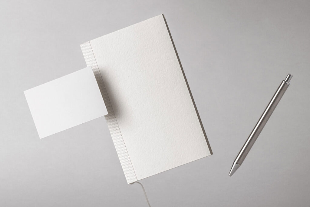 Facing Sight of Floating Notebook Mockup with Pen