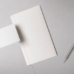 Facing Sight of Floating Notebook Mockup with Pen