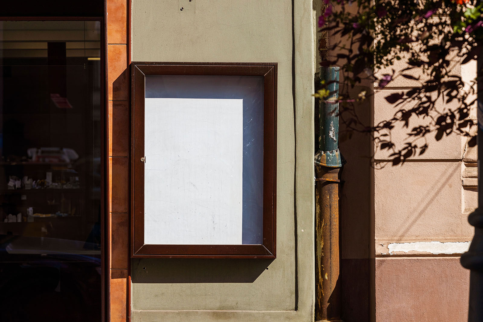 Free Facing Sight of Poster Mockup in Frame PSD Template