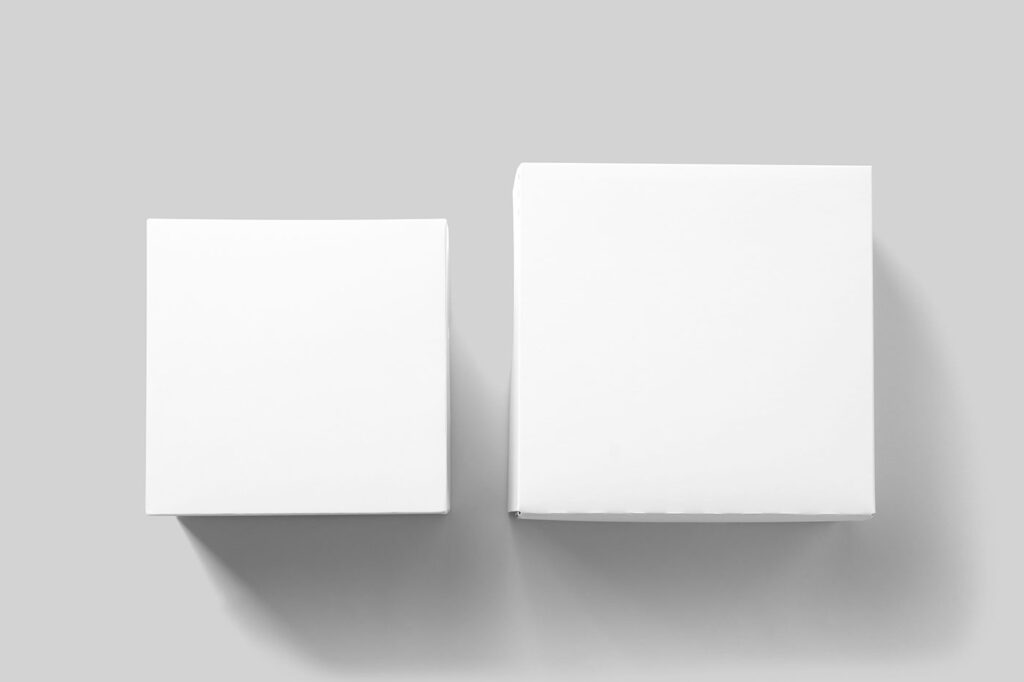Facing View of 2 Lying Square Boxes Mockup