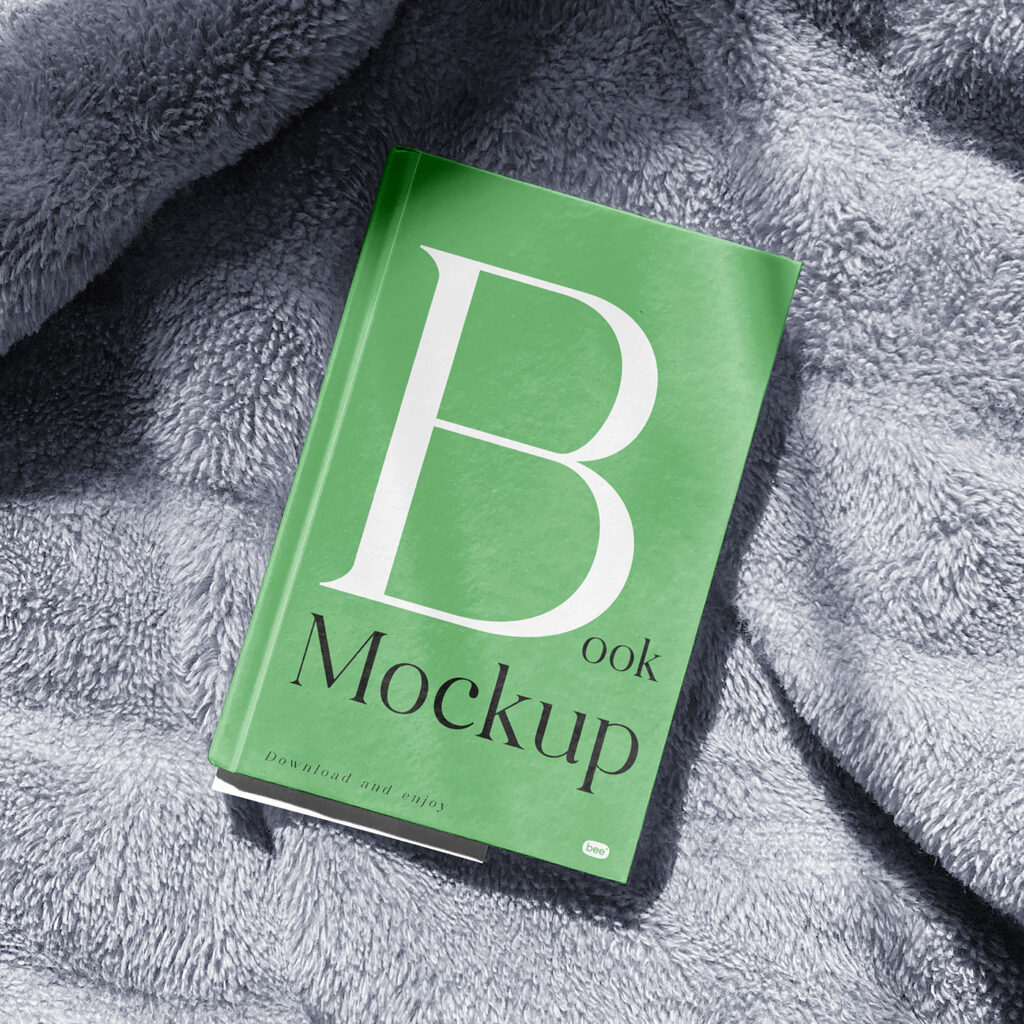 Facing View of Book Cover Mockup on Blanket