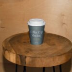 Facing View of Coffee Cup Mockup on Wooden Stool