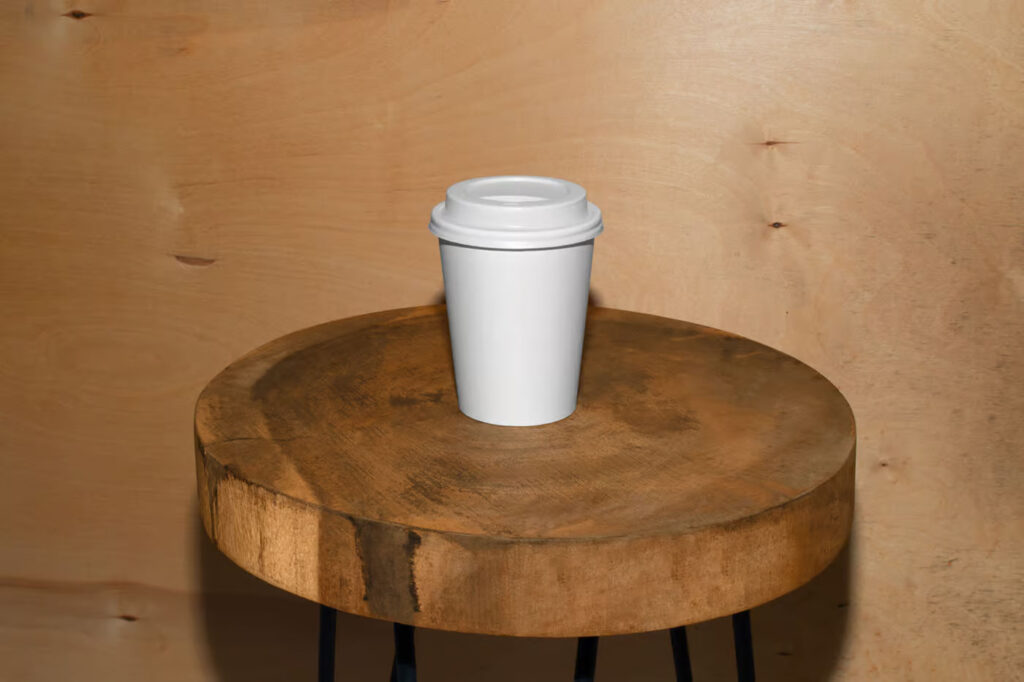 Facing View of Coffee Cup Mockup on Wooden Stool