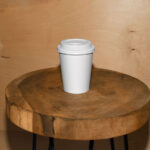 Facing View of Coffee Cup Mockup on Wooden Stool