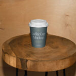 Facing View of Coffee Cup Mockup on Wooden Stool