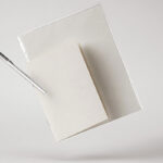Facing View of Floating Stationery Mockup with Notebook