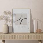 Facing View of Frame Mockup on Table with Decorative Plant