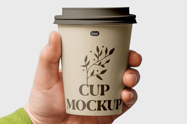 Facing View of Medium Paper Cup Mockup in Hand